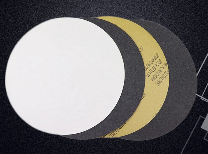 Adhesive backed sandpaper